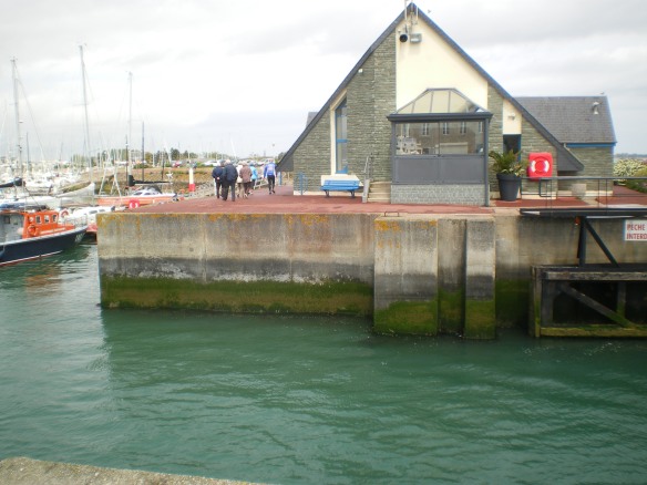 Andy can just be seen, with his back to the camera, starting his long walk around the harbour